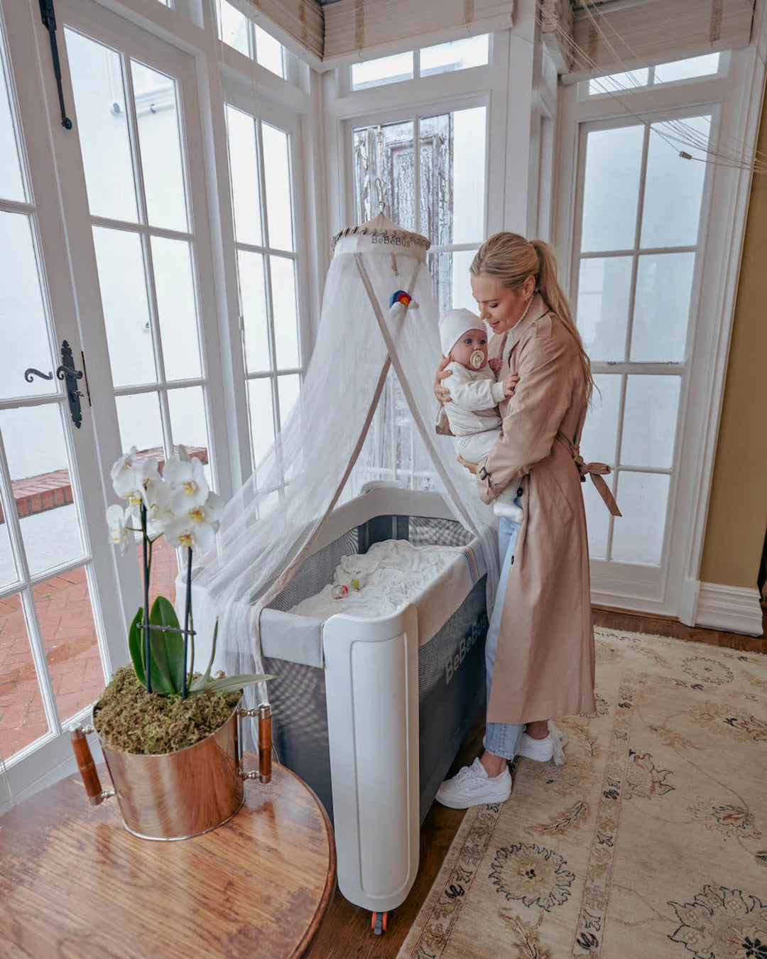 BeBeBus mosquito net over baby crib in a bright nursery, the perfect baby sleep essential and protective nursery accessory for newborns.