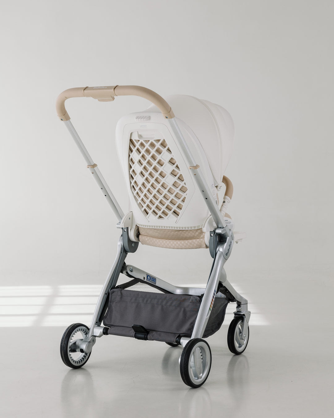 Rear angle of the foldable BeBeBus Art+ PRO Stroller showing breathable mesh backrest and compact frame perfect for travel with babies.