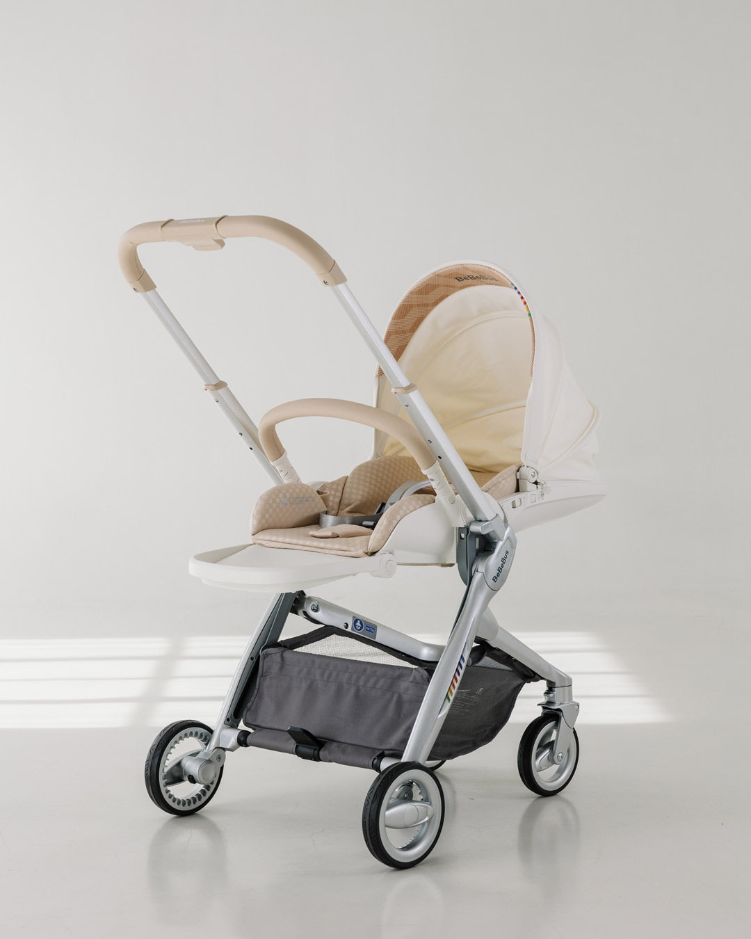 Sleek profile of the BeBeBus Art+ PRO luxury baby stroller in lie flat mode, featuring lightweight design and durable wheels for urban strolling.