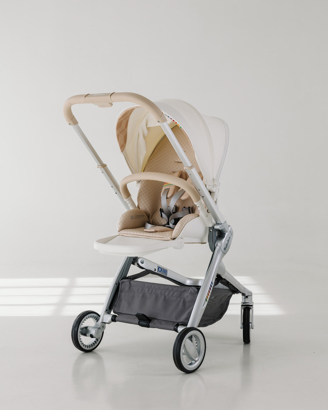 Sleek profile of the BeBeBus Art+ PRO luxury baby stroller in sitting mode, featuring lightweight design and durable wheels for urban strolling.