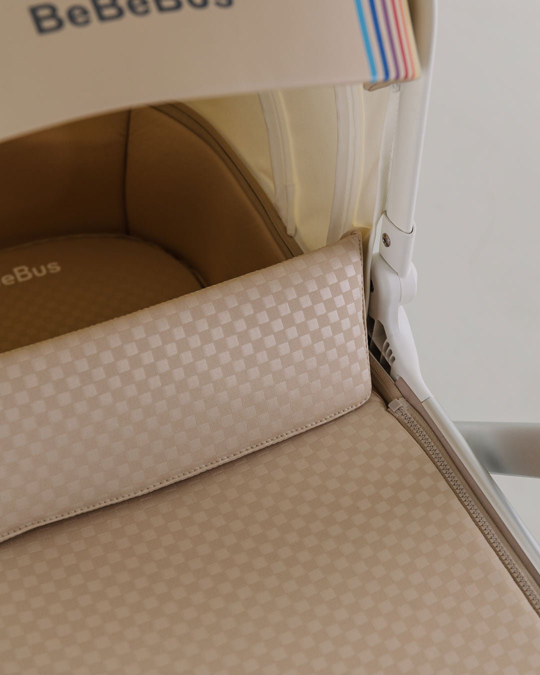 BeBeBus Bassinet with canopy and cushioned mattress for newborns and infants.