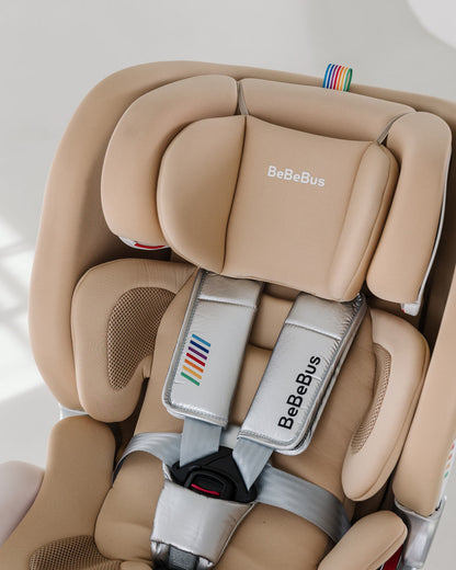BeBeBus Astron+ PRO Car Seat showing soft padded infant headrest and silver five-point safety harness.