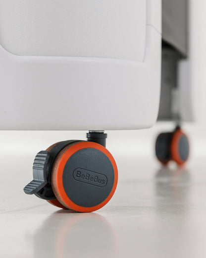 Close-up of BeBeBus Wish Crib lockable wheels for easy mobility and safety, ideal for modern baby cribs and portable playpens.