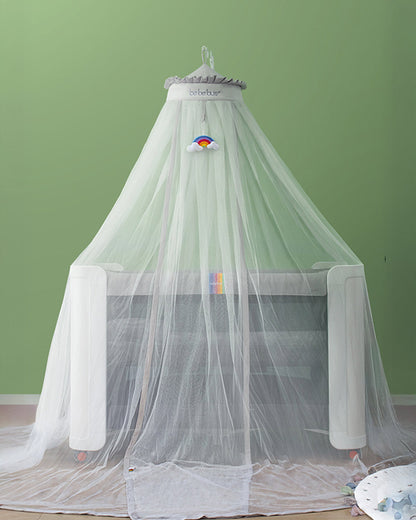 BeBeBus mosquito net over baby crib in a bright nursery, the perfect baby sleep essential and protective nursery accessory for newborns.